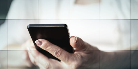 Woman's hands using a mobile phone, geometric pattern