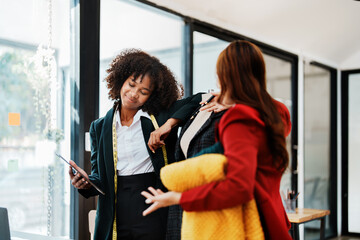 Multi ethnic young teen african american and asian woman fashion designer stylish and friend working at fashion Business studio