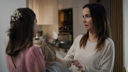 Caucasian woman saying goodbye to her daughter leaving for a prom party. Shot with RED helium camera in 8K.  