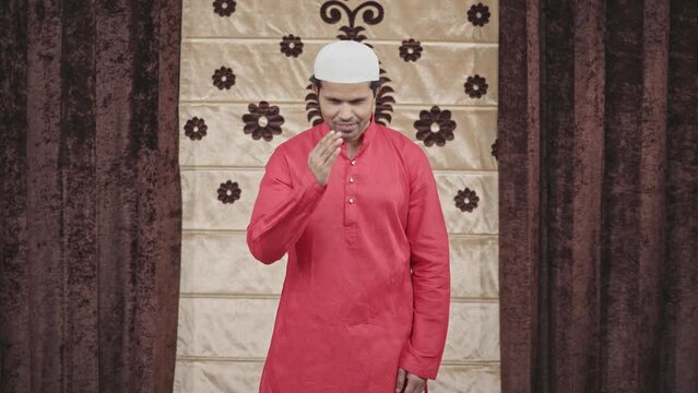 Muslim man doing greetings and adaab towards the camera