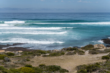 Fototapeta na wymiar Ocean waves on shore at Maclear Beach, Cape Town