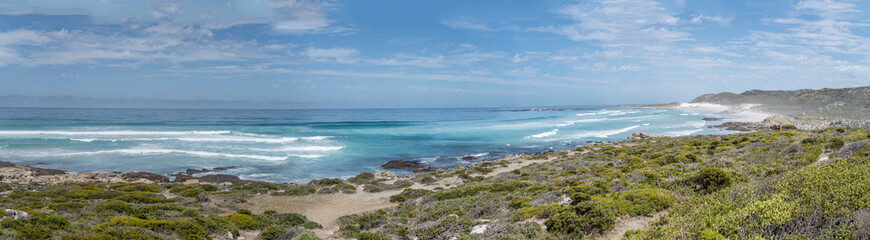 Obraz premium white sand and Ocean waves on shore at Maclear Beach, Cape Town