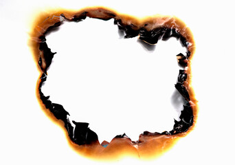 burned hole on a white paper background - obrazy, fototapety, plakaty