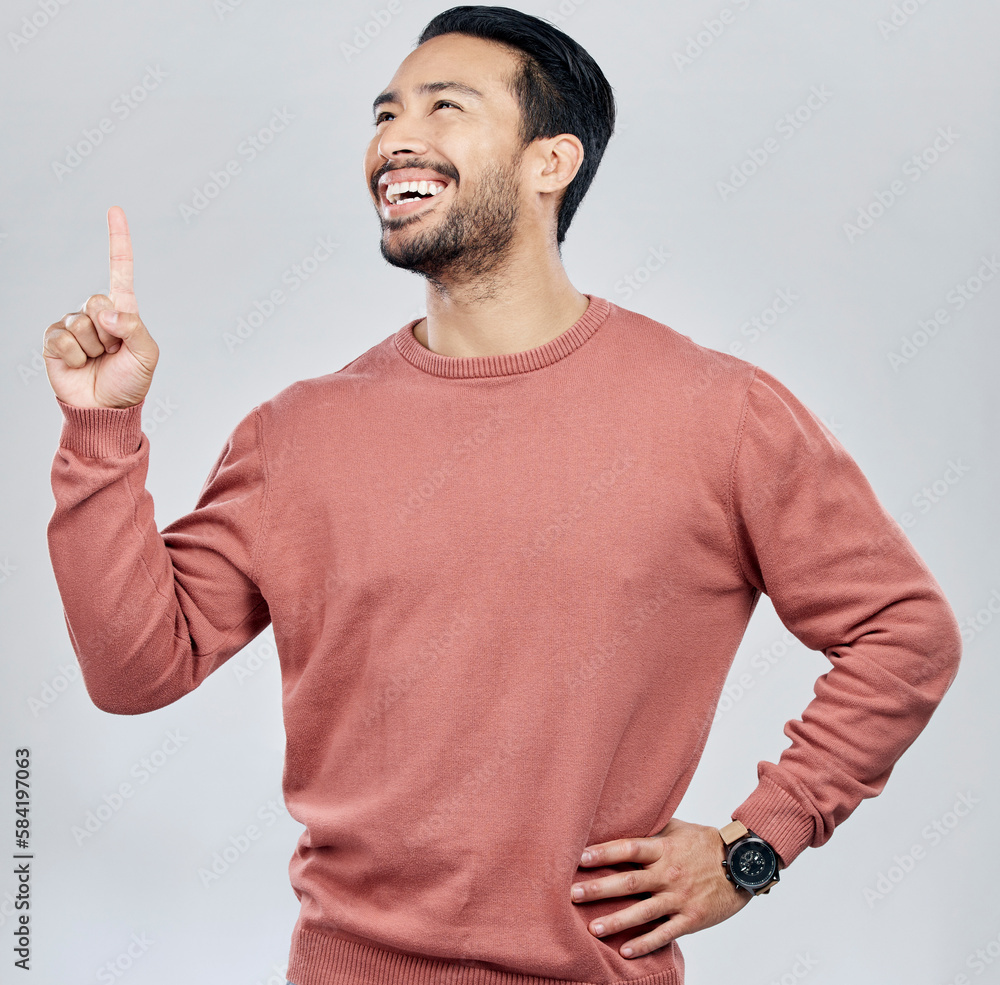 Poster happy, smile and pointing with man in studio for idea, product placement and announcement. success, 