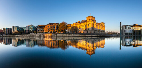 Reichstag with reflection in Spree, Berlin