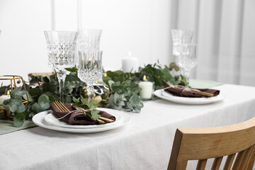 Stylish elegant table setting for festive dinner indoors