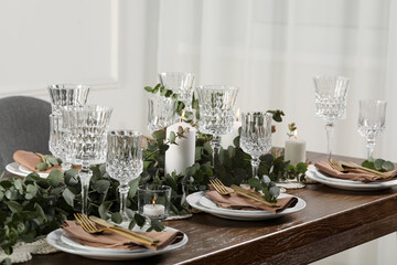 Stylish elegant table setting for festive dinner indoors