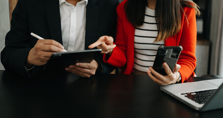 Business team meeting. professional investor working new start up project. Finance task. with smart phone and laptop and digital tablet computer  in morning light.