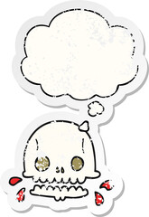 cartoon spooky skull and thought bubble as a distressed worn sticker
