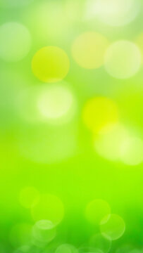 Green Blur Nature image with bright light bokeh texture as vertical blurred story background with copyspace - aesthetic minimal spring textured design