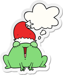 cute cartoon christmas frog and thought bubble as a printed sticker