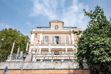 Rome, Italy - September 16, 2021: Casina Valadier at Bucarest Square Rome with blue sky and autumn leaves (inside Villa Borghese park)