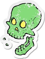 retro distressed sticker of a cartoon laughing skull
