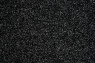 Black fabric background.
