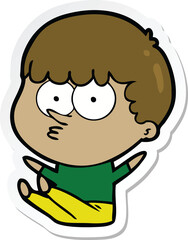 sticker of a cartoon boy sat waiting