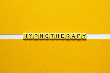 Hypnotherapy - word concept on building blocks