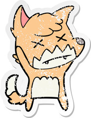 distressed sticker of a cartoon cross eyed fox