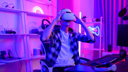 Young Caucasian man Pro Gamer have live streaming  playing video game,  using virtual reality glasses at home