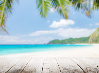 Fototapeta premium Empty wooden table or pier with sunny beach and sea