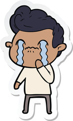sticker of a cartoon man crying