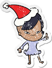 cute distressed sticker cartoon of a girl with hipster haircut wearing santa hat