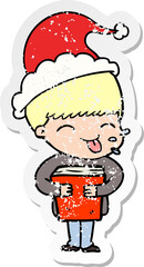 distressed sticker cartoon of a boy wearing santa hat