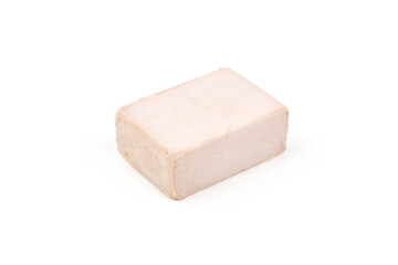 Fresh yeast cube, isolated on white background.