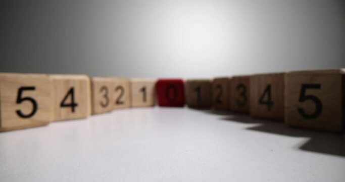 Wooden cubes with numbers and red zero closeup 4k movie