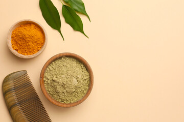 Flat lay composition with henna and turmeric powder on beige background, space for text. Natural hair coloring