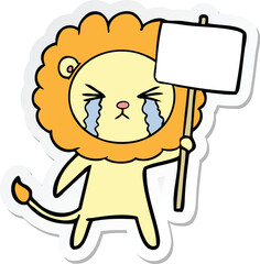 sticker of a cartoon crying lion with placard
