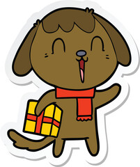 sticker of a cute cartoon dog with christmas present