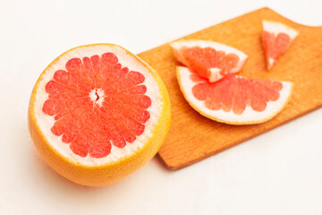 Obraz na płótnie Canvas Freshly harvested grapefruit on white background