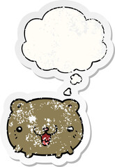 funny cartoon bear and thought bubble as a distressed worn sticker