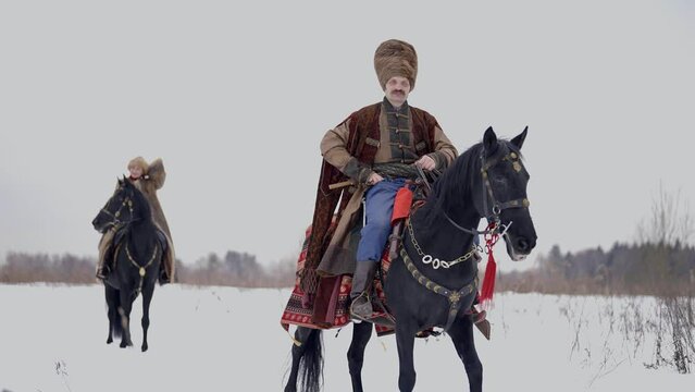 Polish or Russian nobility of 12 century, man and woman riding horse, historical reconstruction