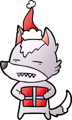 gradient cartoon of a wolf with a gift wearing santa hat