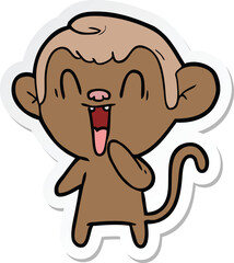 sticker of a cartoon laughing monkey