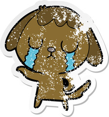 distressed sticker of a cute cartoon dog crying