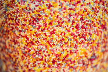 Fototapeta na wymiar background of colorful round sweet sprinkles for baking