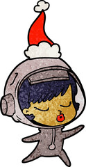 textured cartoon of a pretty astronaut girl wearing santa hat