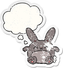 cartoon rabbit and thought bubble as a distressed worn sticker