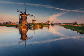 Morning among the windmills in Kinderdijk - one of the most characteristic places in the...