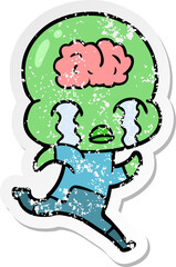 distressed sticker of a cartoon big brain alien crying