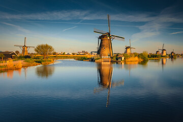 Morning among the windmills in Kinderdijk - one of the most characteristic places in the...