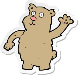 sticker of a cartoon waving bear