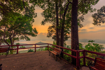 The natural background of the beautiful twilight sky, the surrounding atmosphere (trees, rivers, mountains) is a beautiful view of the journey, the view point.