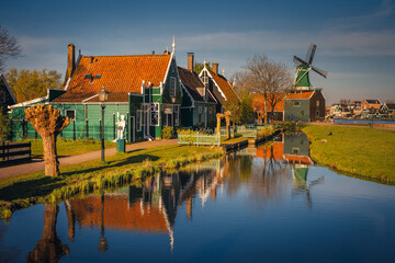 Naklejka na ściany i meble Morning at Zaanse Schans in the Netherlands - it is one of the most beautifully located open-air museums in Europe. Here we will find classic Dutch buildings.