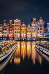 Canals in Amsterdam - the capital of the Netherlands in a night scenery. The huge amount of colors...