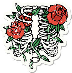 traditional distressed sticker tattoo of a rib cage and flowers