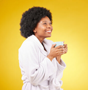 Happy, Coffee And Relaxed Black Woman In Studio, Waking Up And Smile On Yellow Background Space. Carefree, Relax And Female With Tea In Bathrobe, Satisfied And Cheerful, Stress Relief And Isolated