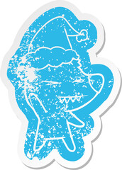 angry polar bear cartoon distressed sticker of a wearing santa hat